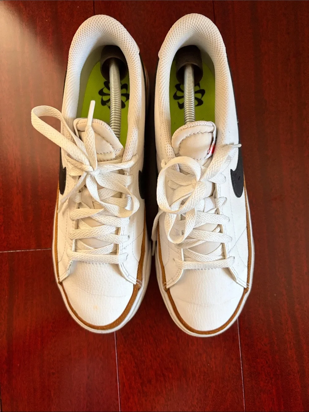 Nike WoMen’s White Sneakers with Black Swoosh and Gold Trim